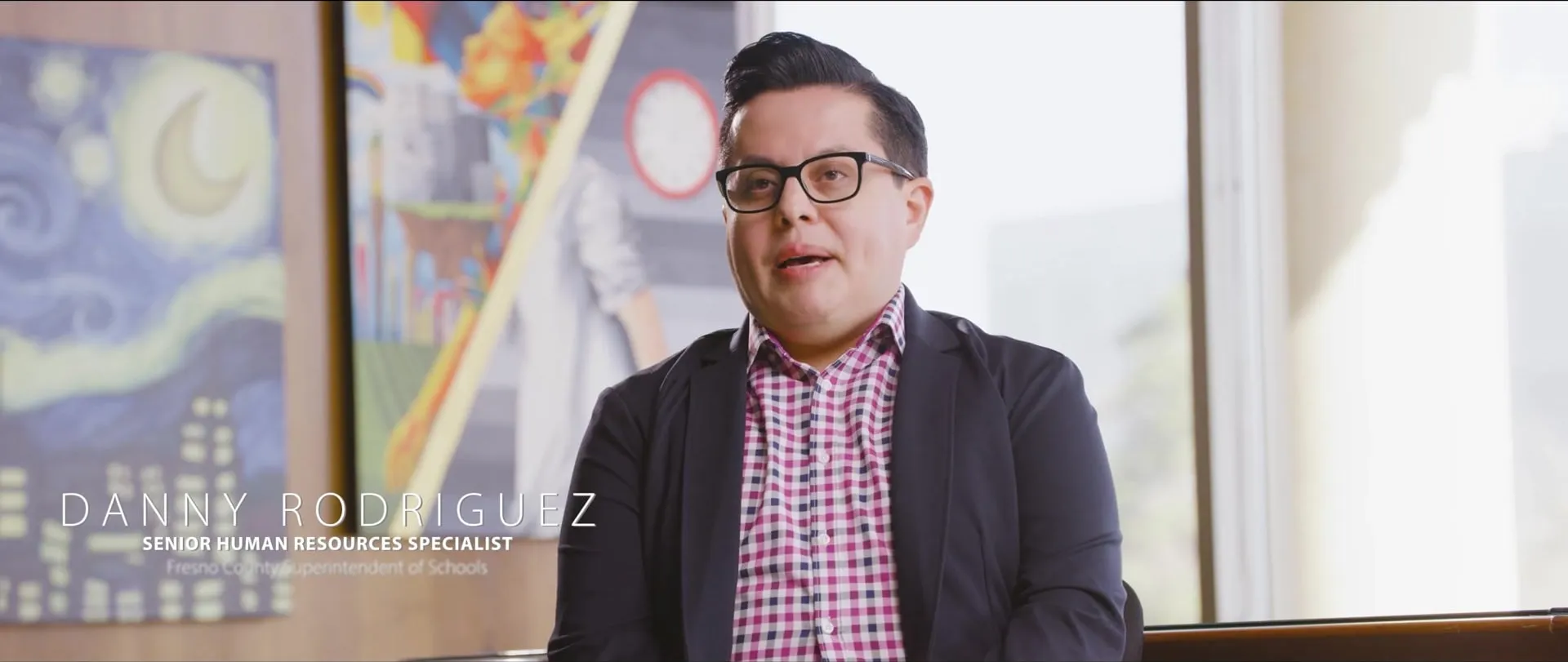 Danny Rodriguez in his office, framed with a lower-third title.