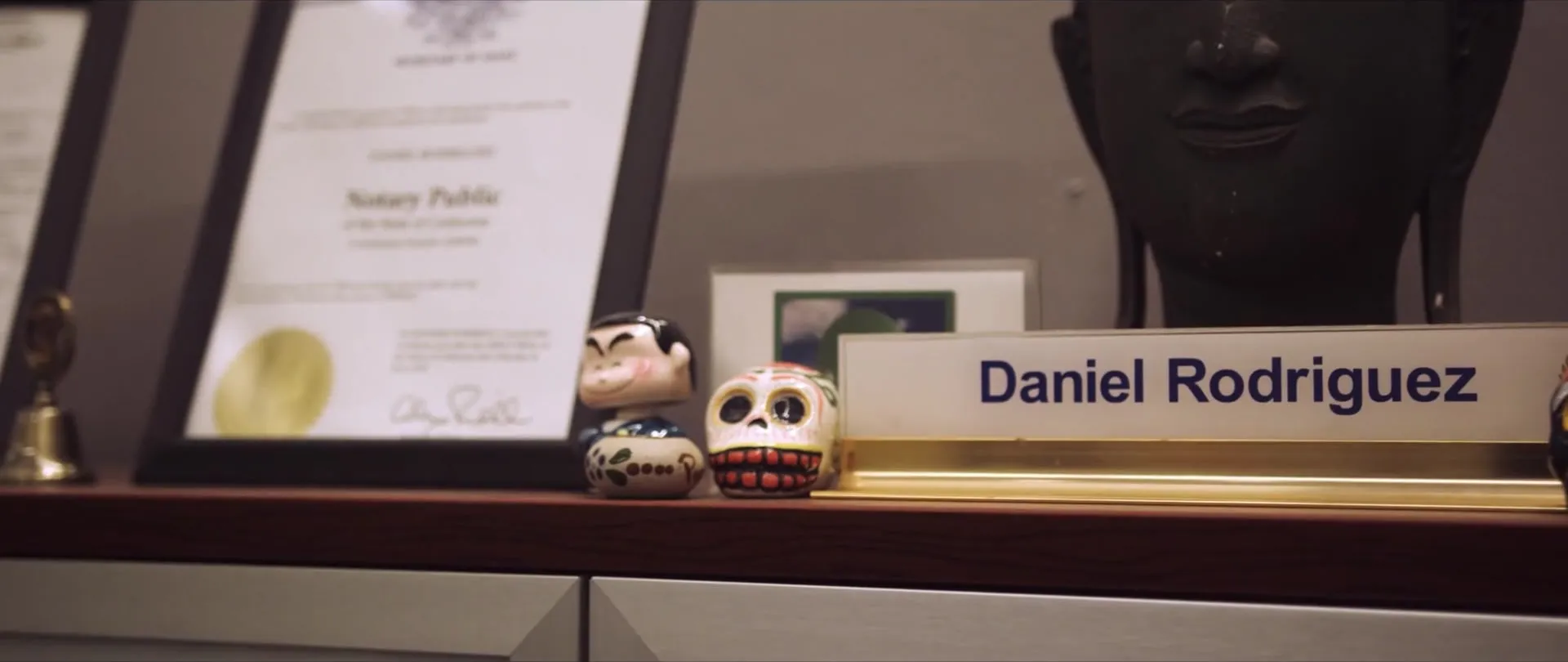 Danny’s nameplate on a shelf of keepsakes.