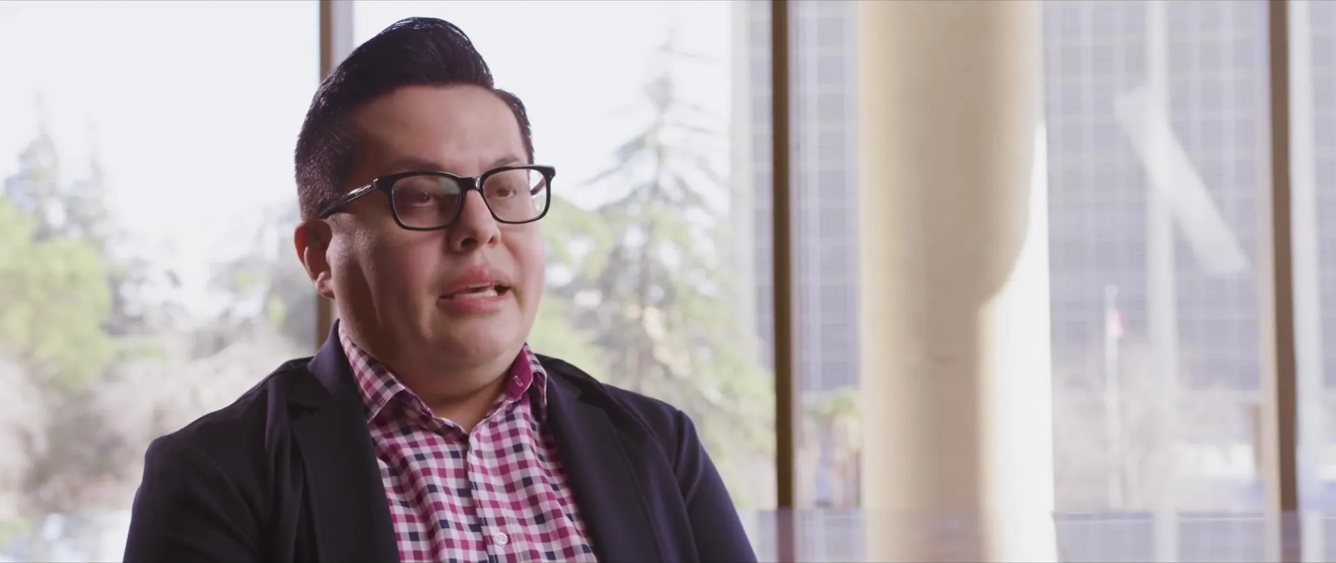 Close-up of Danny mid-interview.